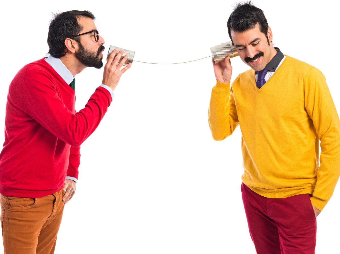 Twin brothers talking through a tin phone Twin brothers talking through a tin phone